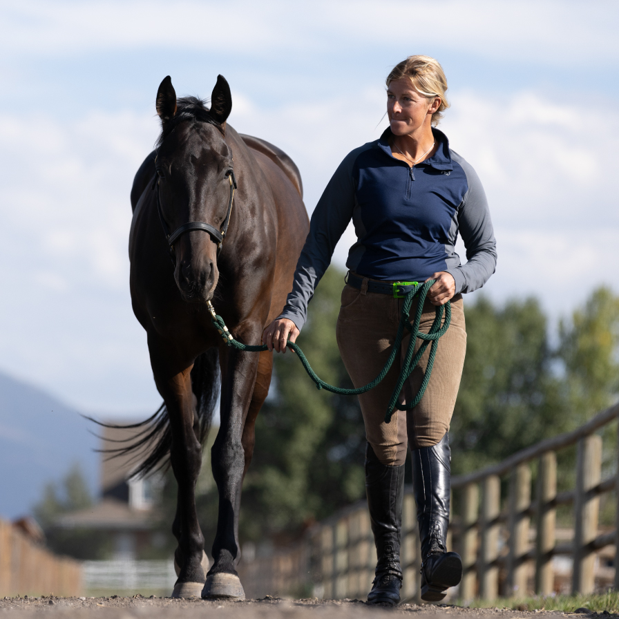 Women leading a horse