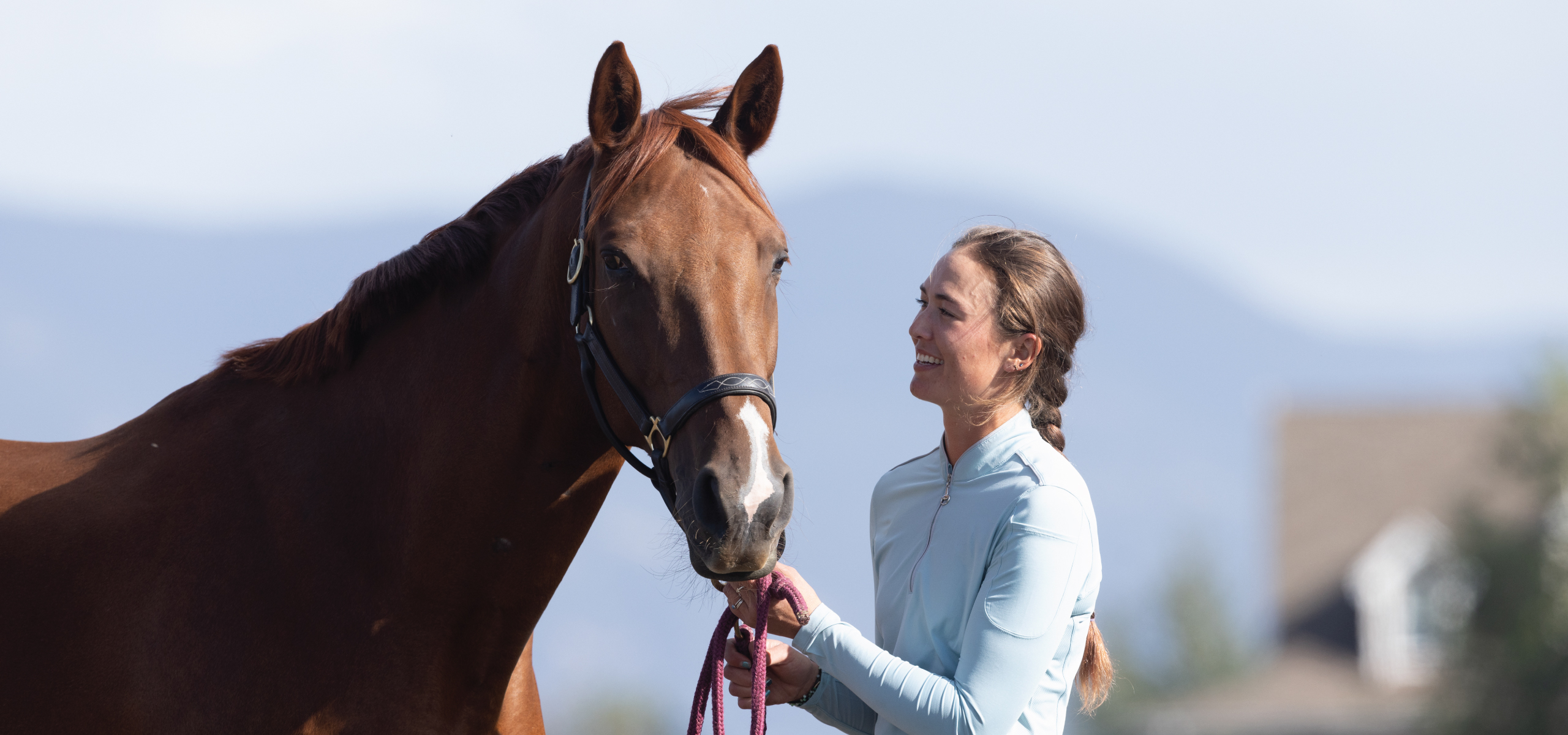 Women laughing with horse